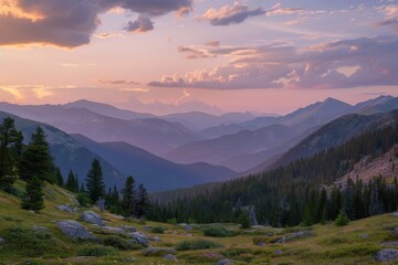 Fototapeta premium Sunlit Mountain Peaks and Misty Forest
