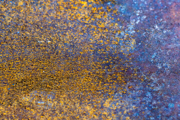 The background is rusty metal