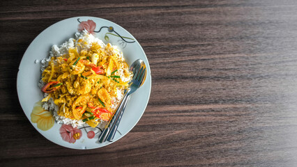 Stir-fried prawns with curry powder with fried egg rice, Thai food thai cuisine food on dish look good tase. wooen table 