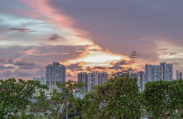 Fototapeta premium Gorgeous scenic of sunset with beautiful cloud and sky over metropolitan city. Bangkok city skyscrapers after sunset with Beautiful sky background, They can be used as Wallpaper, Copy space.