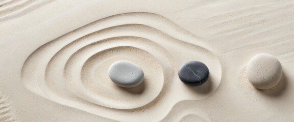 Three smooth stones placed in a carefully raked sand garden, creating concentric patterns that evoke tranquility and mindfulness, ideal for relaxation and meditation themes.