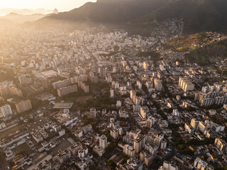 Beautiful sunrise aerial view to mountains and city buildings