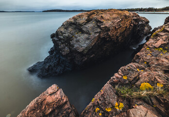 Long exposure of rocky coastline along ocean, Eastport, Maine