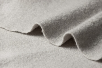 Close-up of folded grey fabric with soft texture
