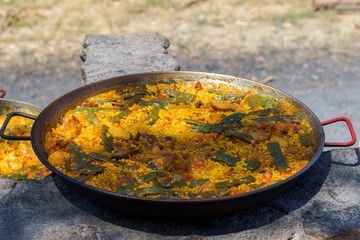 close-up of a typical Spanish paella cooked over a wood fire