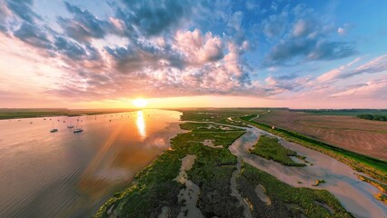 An aerial view of a spectacular sunset over the River Deben at Bawdsey Beach in Suffolk, UK