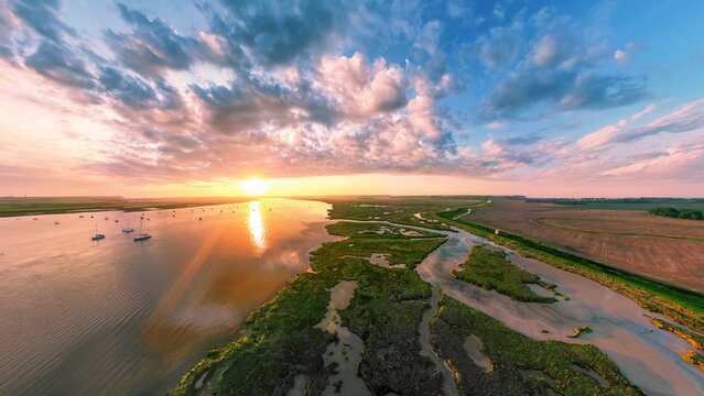 An aerial view of a spectacular sunset over the River Deben at Bawdsey Beach in Suffolk, UK