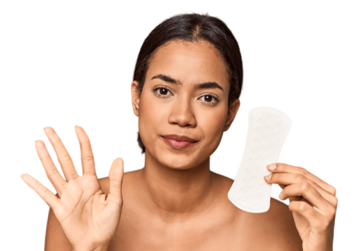 Filipino woman with sanitary pad in studio smiling cheerful showing number five with fingers.