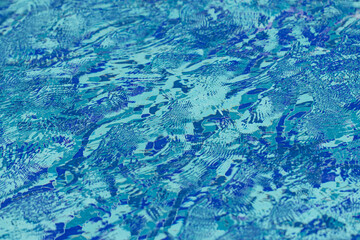 small waves on blue water as a background.