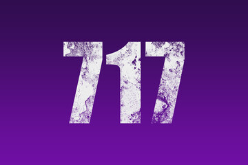 flat white grunge number of 717 on purple background.	