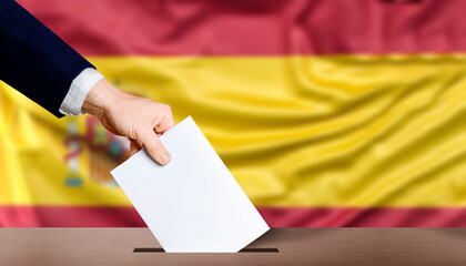 Hand holding ballot in the ballot box with the flag of Spain in the background. Spain general elections, voting concept
