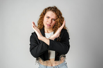 Young Woman Standing With Her Arms Crossed