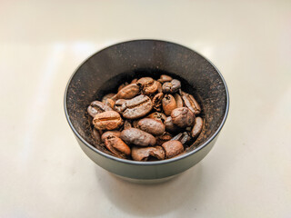 A captivating photo showcases coffee beans nestled within a dosing ring pressurized basket, ready for the perfect espresso extraction. 