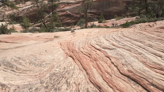 Panning view of the sandstone patterns and texture in the Utah desert in the Zion wilderness.