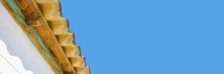 Old aged and damaged dangerous roof made of prefabricated and wave-shaped panels - Web banner...