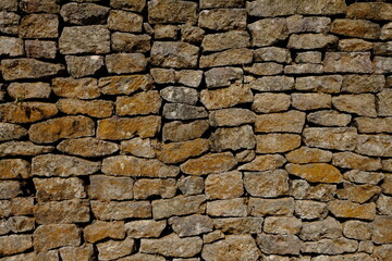 Obraz premium natural stone wall. box-shaped natural stone stacked into a natural stone wall. limestone, andesite, marble is often used for natural stone walls. this stones is a good architectural element.
