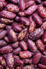Uncooked, red and white kidney beans background. Top view. Close-up
