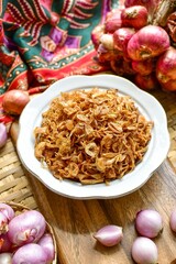 Crispy fried shallots on white bowl