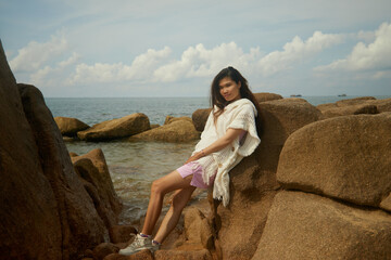 woman sitting on the beach