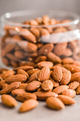 Peeled almond nuts on kitchen table.