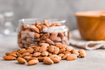 Peeled almond nuts on kitchen table.