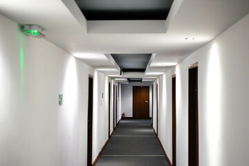 corridor in a hotel painted with white paint