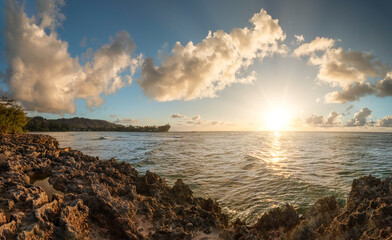 Hawaiian Kawela Bay Beach colorful Sunset Phase with silhouette palm trees