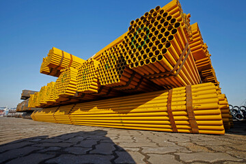 Yellow stacked steel pipe