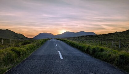 Empty scenic road trough nature and mountains at sunset, Inagh valley, Connemara, Galway, Ireland, landscape background, wallpaper © Hq Visual Studio
