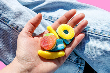 Woman holding jelly candies in hand