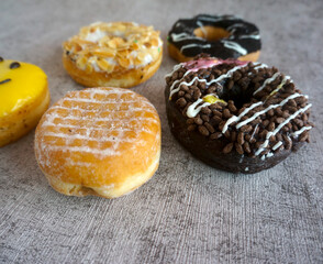 Sweet Berliner And Donut With Chocolate Topping On Grey Background