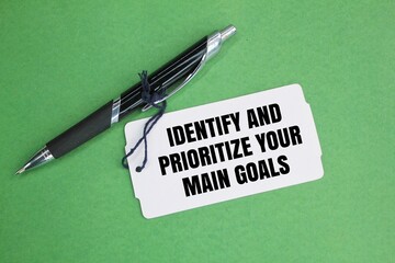 pen and paper tag with the words Identify and prioritize your main goals