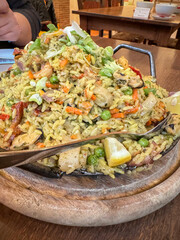 side view seafood paella plate on table