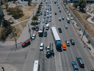 A truck and a car collided on the highway. Serious accident. Traffic accidents on the road. View from above. Traffic jam. Insured event on the road.