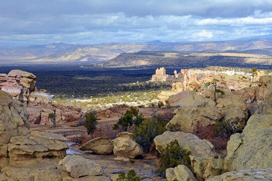 looking out from the sandstone bluffs overlooks at lava fields in el malpais national monument, near grants,  in northern new mexico