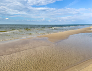 sand beach on the baltic sea with clouds