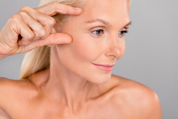 Close up photo of pensioner woman touch apply plastic surgery remove wrinkles pure soft facial skin...