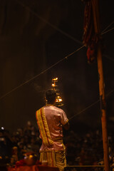 Ganga aarti, Portrait of young priest performing holy river ganges evening aarti at dashashwamedh...