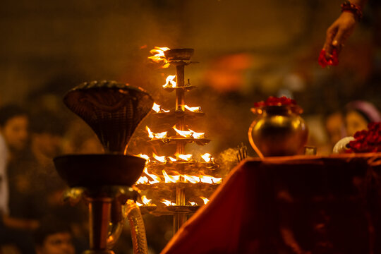 Ganga aarti, Fire flame at night with dark background during the ganga aarti rituals at river bank of Varanasi.