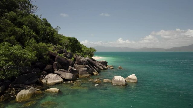 Aerial view of Nudey Beach with turquoise ocean and sandy shore, Fitzroy Island, Queensland, Australia.
