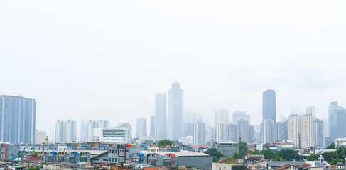 Obraz premium view of the buildings in the city of Jakarta from the Manggarai train station, cloudy cityscape, Jakarta city cityscape