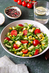 Salad with avocado, tomatoes and corn. Healthy eating. Vegetarian food.