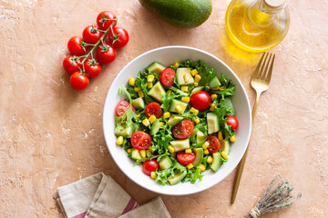 Salad with avocado, tomatoes and corn. Healthy eating. Vegetarian food.