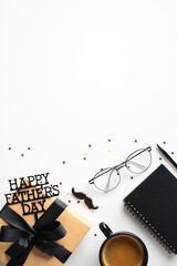 Father's Day themed photo featuring a gift box, coffee cup, reading glasses, and a notebook on a white background. Decorated with HAPPY FATHER'S DAY text and star-shaped confetti. Ideal for Father's D