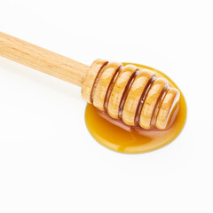 honey wooden dipper isolated on white background