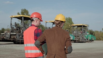 Competent man controlling work at construction site outside