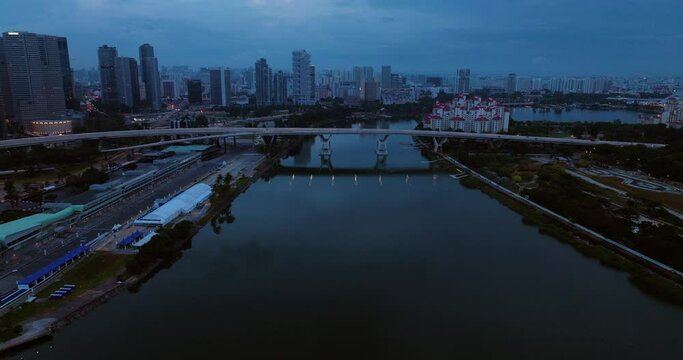 Benjamin Sheares Bridge Across Marina Bay During Blue Hour In Singapore. drone tilt-up shot