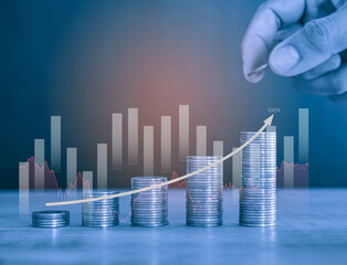 Upward Stack of money coin and man hand holding coin to stack with upward trending business and...