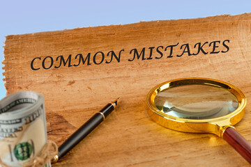Common mistakes, text on papyrus next to a magnifying glass and money