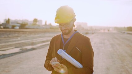 Man using modern gadget for work at site